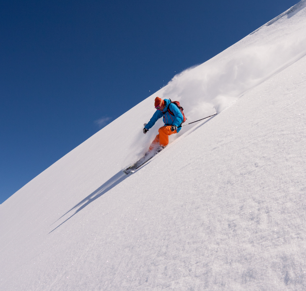 A skier on a steep slope as a metaphor for cost reduction